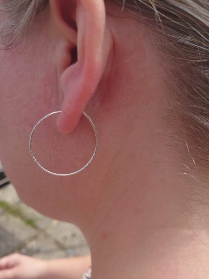Hammered hoop earrings 3cm on ears5